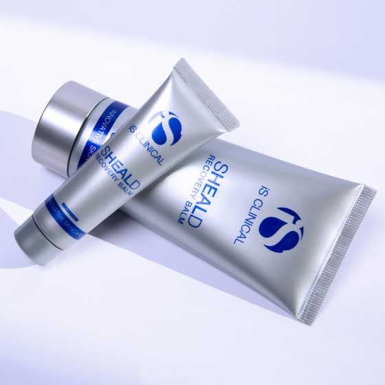 Silver skincare tubes on light background.