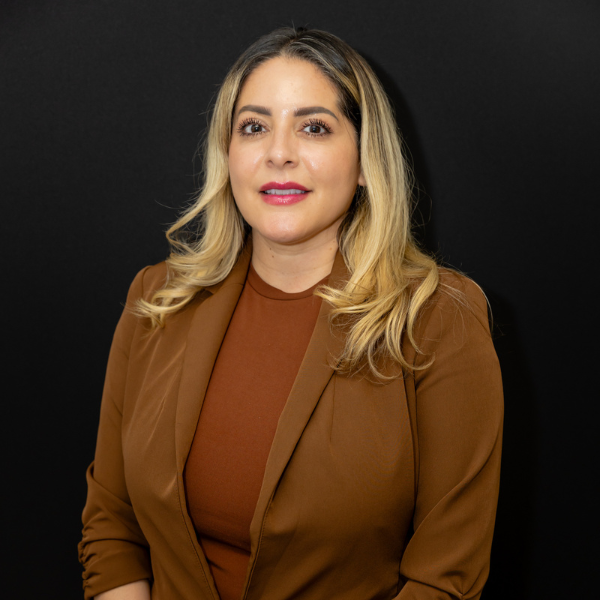 Woman with blonde hair wearing brown blazer